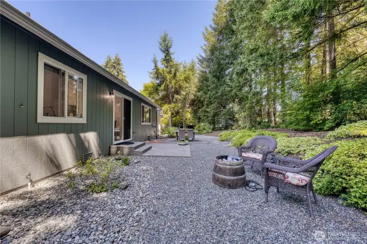 Set on a shy 1/2 Acre with lush green evergreen trees and privacy.
