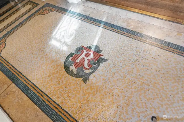 The original mosiac tile in the entry