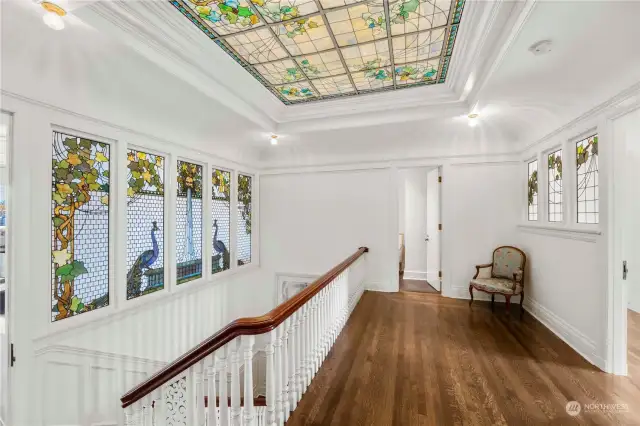 Second floor landing. Stained glass accentuates the beauty