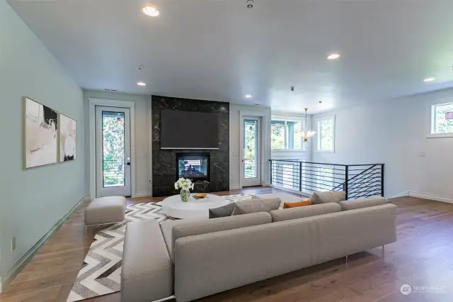 Living space with doors to the front deck looking out to Coal Creek