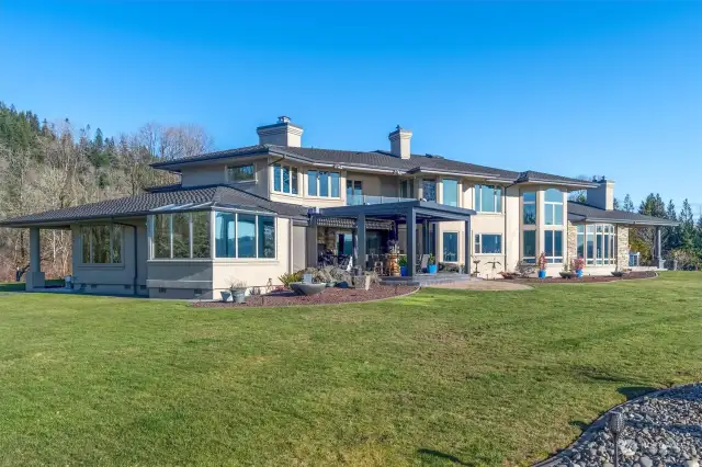 River side view of the home. Imagine when the built-in event lights are on at dusk!