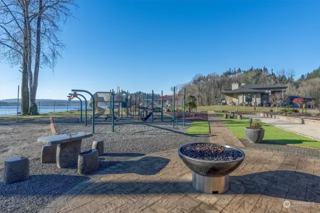 Playground is fenced on 3 sides and even has the proper ground cover for a soft landing. Bocce ball court.