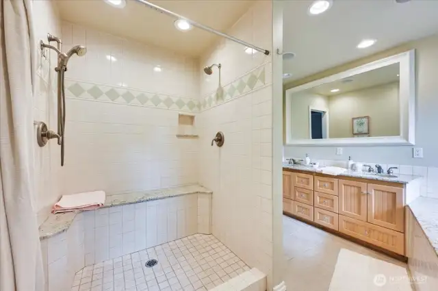 Large, separate shower with three shower heads