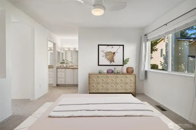 Primary bedroom with view towards sink area & vanity. Virtually staged to give you a sense of the potential!