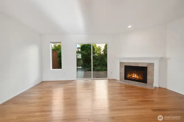 Dining room with view towards living and back deck - shown without staging - look at those floors!