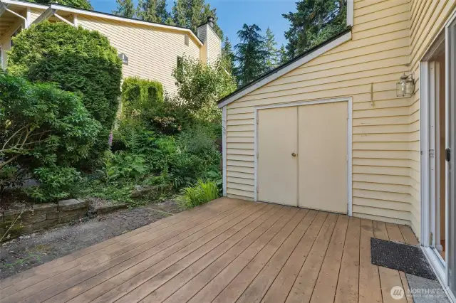 Private deck off living room with locked storage. Nice private greenscape & place to bbq!