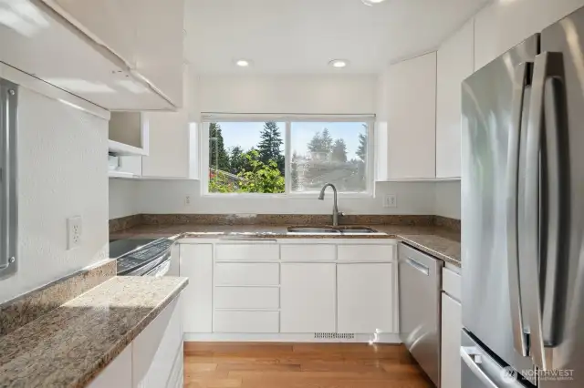 Updated kitchen with high end appliances, granite counters & extra tall cabinets for great storage!