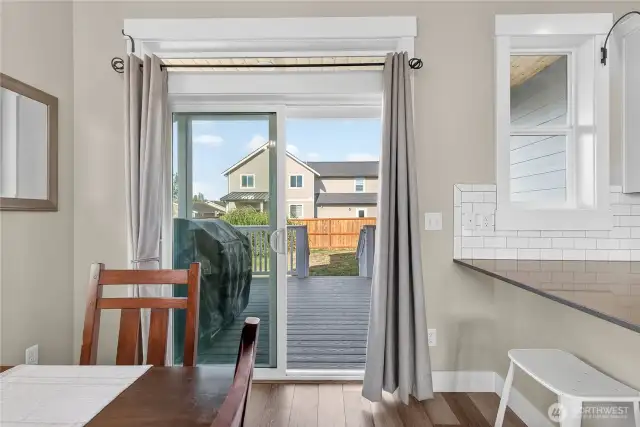 Dining adjacent to the kitchen and the covered back deck.