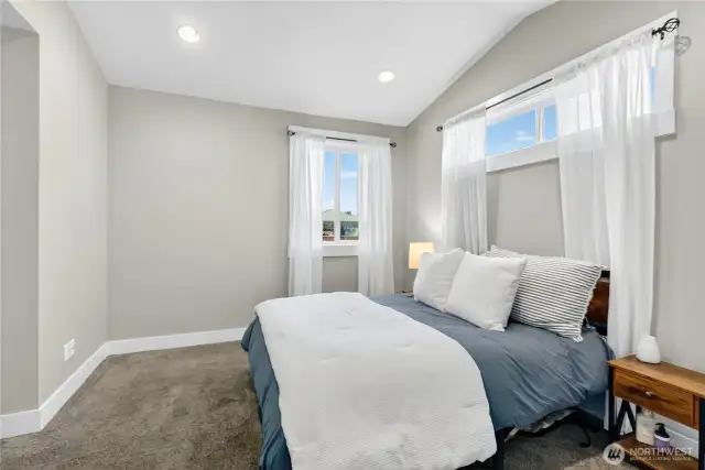 Main floor primary bedroom with en-suite bath and walk-in closet.