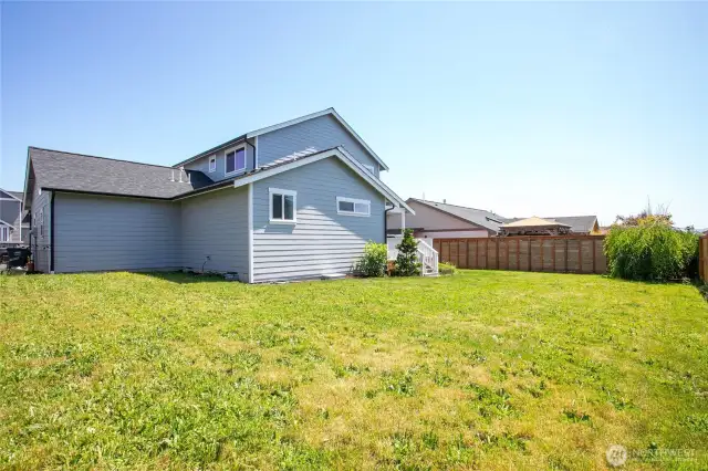 Backyard has a privacy fence borders all 3 neighbors.