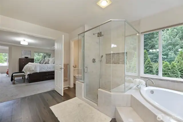 The recently remodeled spa-inspired bathroom features high-end fixtures, custom tile, and so much more.
