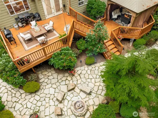 Flagstone paths, hardscape, and fully fenced yard—gather, garden & play!