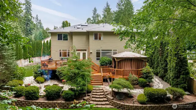 .6-acre lot backing to lush greenbelt—privacy meets pristine Northwest beauty