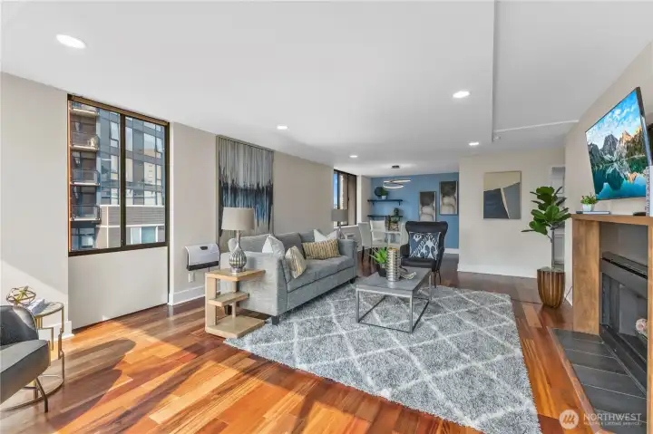 Expansive great room with engineered hardwood floors and open-concept design.