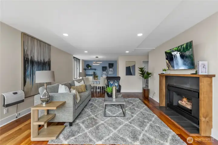 Warm and inviting living space with a fireplace focal point and natural light.