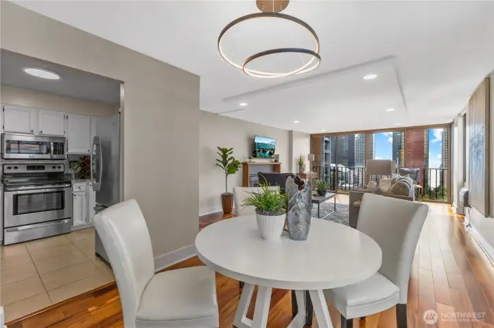 Open flow from dining to living room and kitchen, designed for modern living.