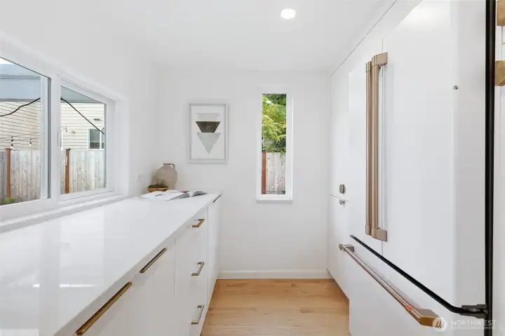 This kitchen nook has tons of storage & extra counter space