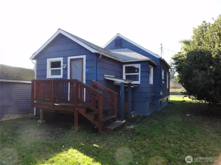 Rear of home with deck.