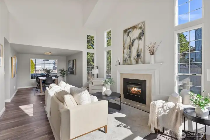 Tall windows flood the main level with light