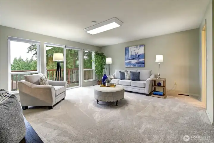 A spacious main-level flex room with powder bath offers endless possibilities—guest space, home office, or additional bedroom.