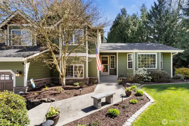 Arrive home to a charming front entry, where a landscaped walkway sets the tone for a warm and inviting welcome.