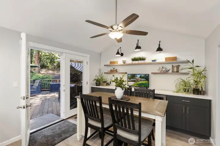 Gather in this bright dining space with easy access to the deck, complete with a built-in buffet and wine fridge—perfect for hosting and family dinners that linger.
