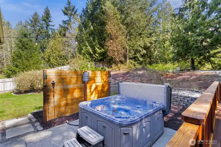 Unwind in your private hot tub, where evenings are spent under the trees and stars.