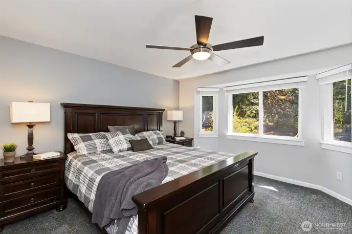 Light-filled, the spacious primary suite offers peaceful views and a true sense of retreat.