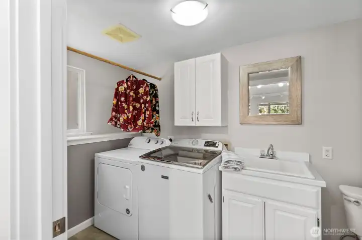 Dedicated laundry room paired with a convenient 1/4 bath for everyday ease.
