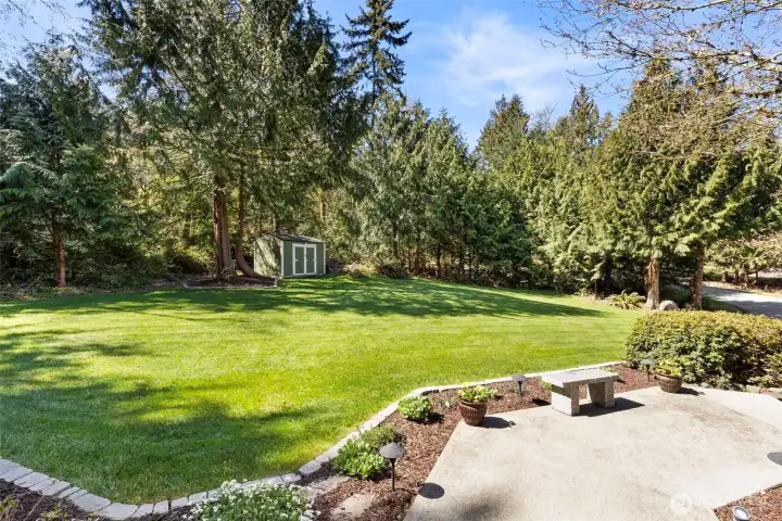 Framed by large, lush front landscaping, the view from your living room feels peaceful and inviting.