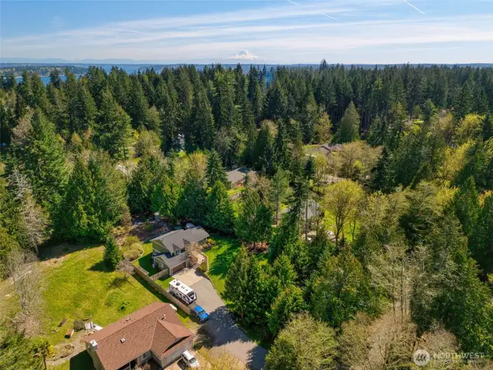 Sweeping aerial view capturing the beauty of the property and its peaceful, natural surroundings.