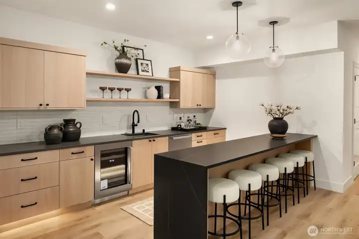 This lower level second kitchen/bar is the perfect set up for entertainment.