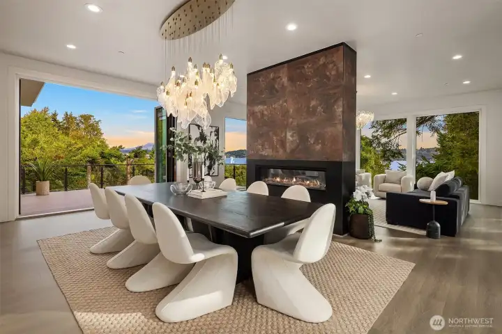 Open-air dining meets cozy fireside living, framed by sunset views over Lake Washington and Mount Rainier