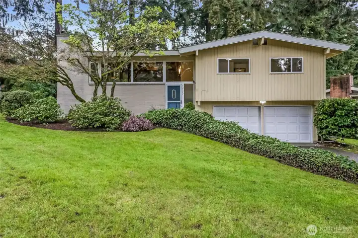 Timeless mid-century modern style with thoughtful updates in this refreshed split-entry home in the sought-after Newport Hills.