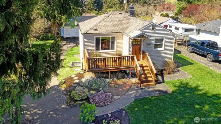 Aerial view of the front of the property shows the well maintain and landscaped property.