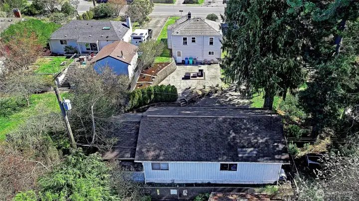 Aerial view facing East.  The 4 car detached garage located in the back of the property can be used for a variety of options.