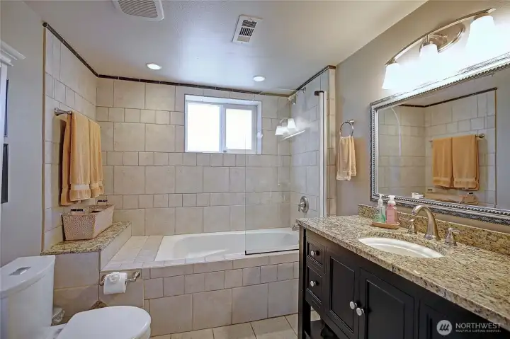 Enjoy the jetted soaking tub in the bathroom.