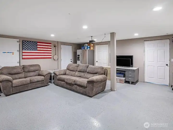 Large living area with epoxy coated concrete floor.