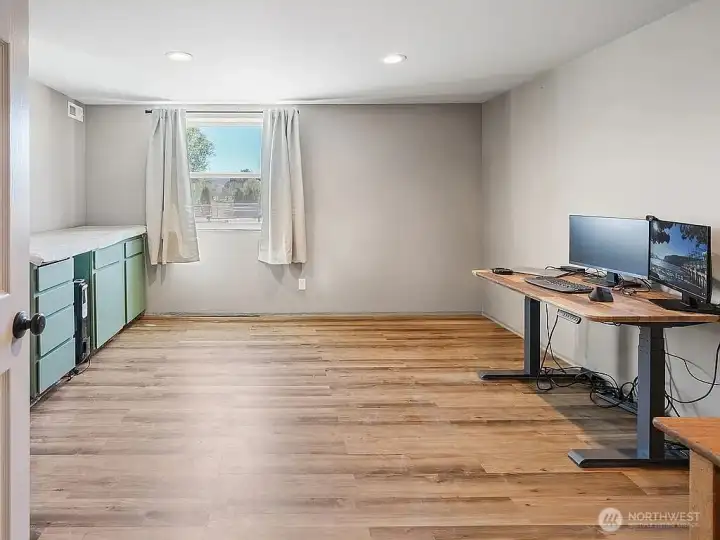 Office with south facing window and pergo snap in flooring.