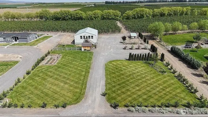 Beautifully landscaped lawn on underground automatic sprinklers.  Two RV parking spots with full hookups.