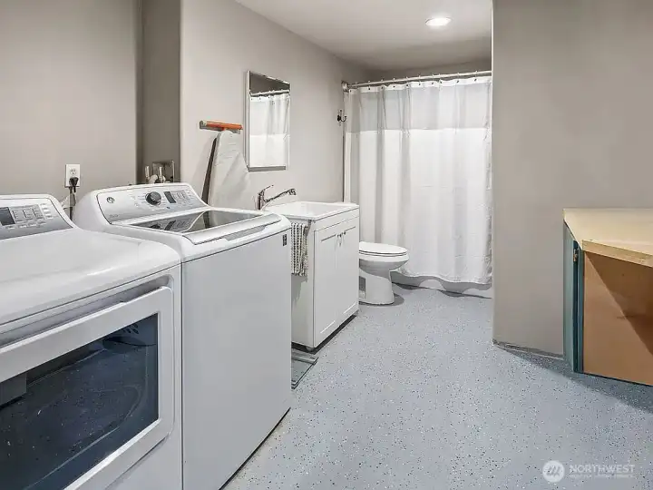 Laundry area with combination tub/shower.