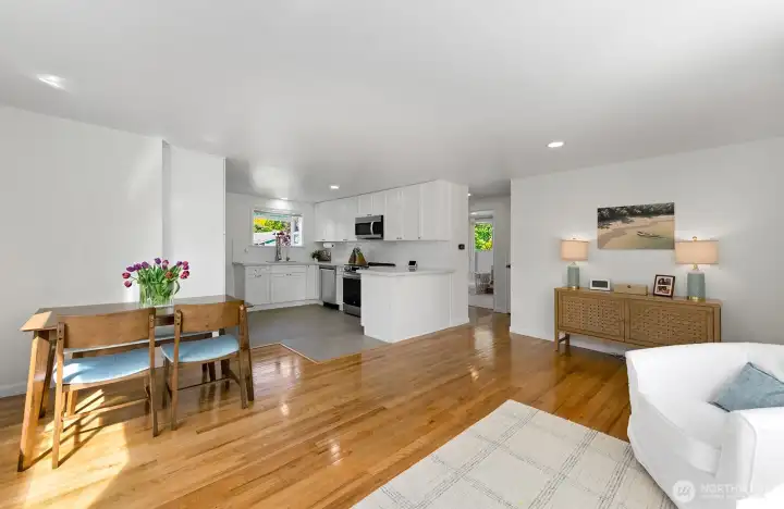This home was remodeled to open up the floorplan and create a great room - living, dining and kitchen.