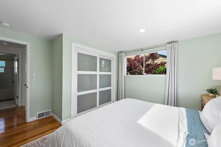 Both main floor bedrooms have new closet doors and Crate & Barrel closet organizers.