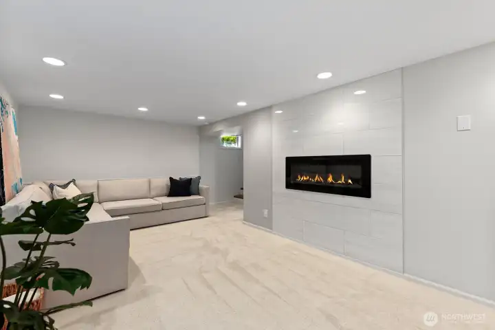Another view of the family room showing the linear electric fireplace.