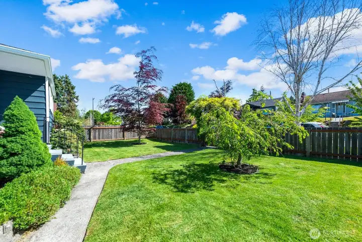 This is a view of the front yard - it is also fenced with a gate.