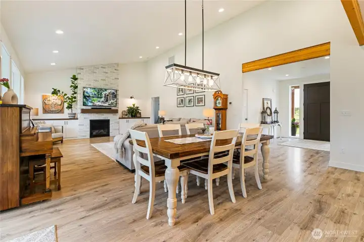 This spacious dining area overlooks the front entryway and living room, while vaulted ceilings create an even greater sense of openness. Exposed beams add warmth and character to the space.