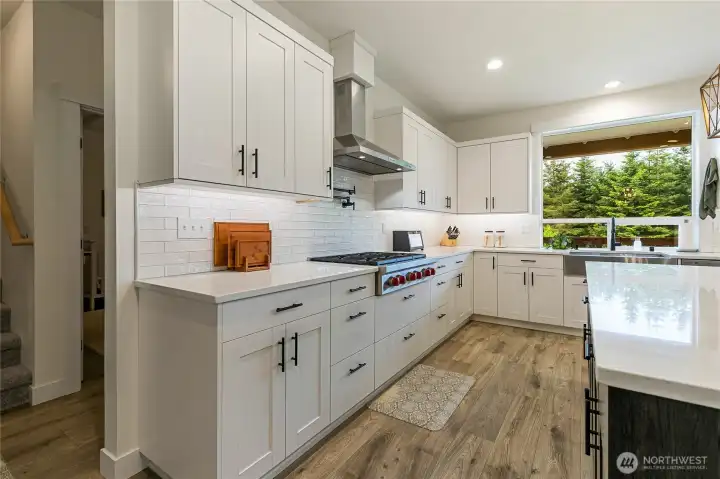 The subway tile backsplash adds a timeless touch, further enhancing the home’s modern farmhouse style.