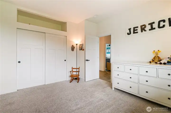 Bedroom #2 with extra open storage space above closet.