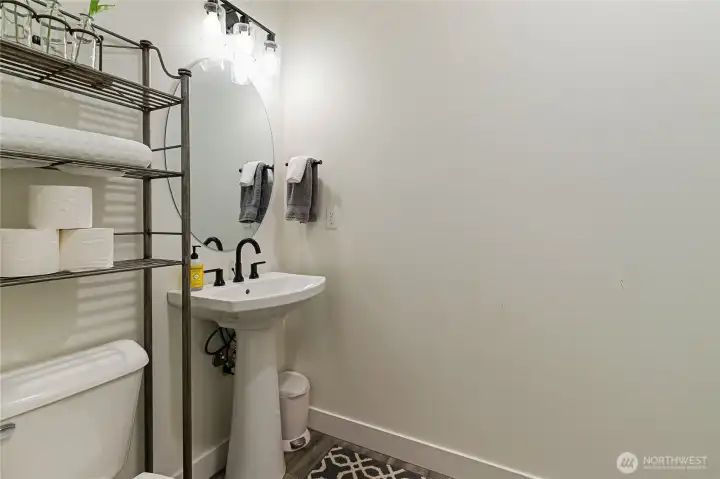 Powder room off mud room.
