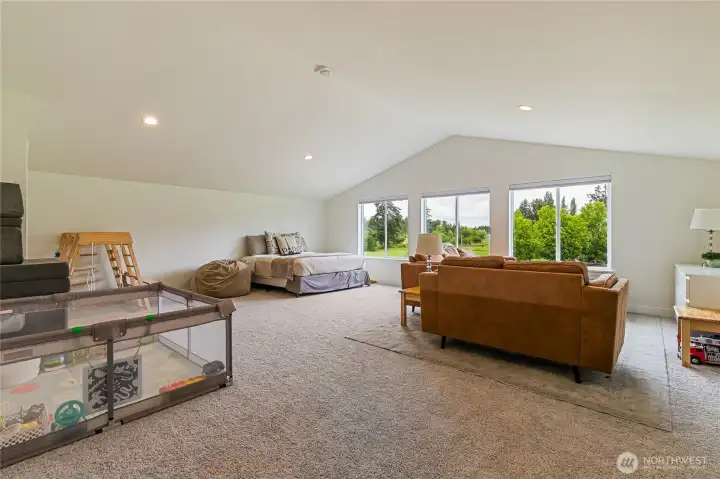 Upstairs you’ll find an expansive 607 sq. ft. bonus room offering versatile additional living space—ideal as a playroom, media room, family or game room, or even a bedroom. It also includes a convenient walk-in closet for added functionality.